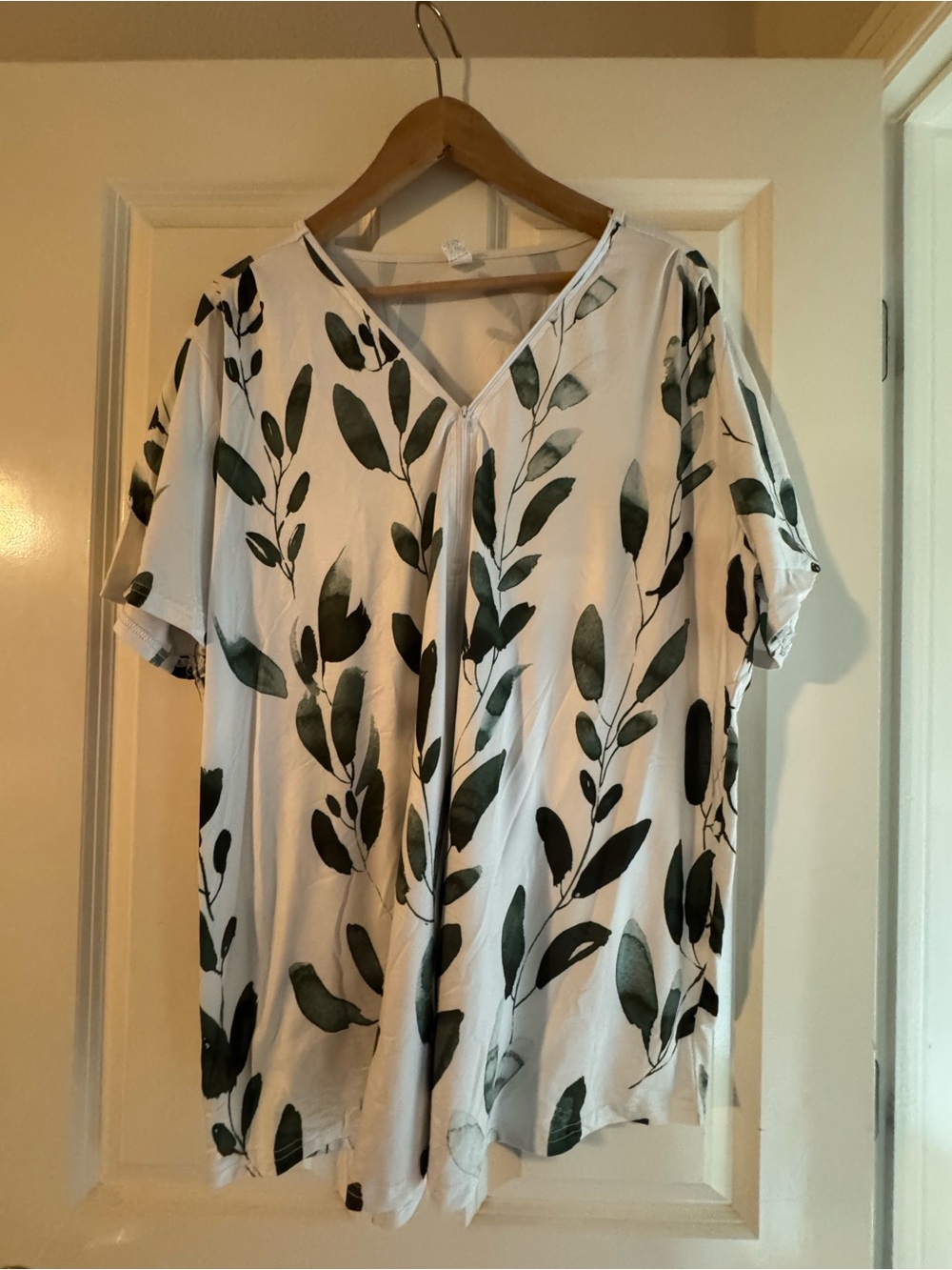 Women's White Short Sleeve V-Neck Top with zipper detail and Green Leaf Print